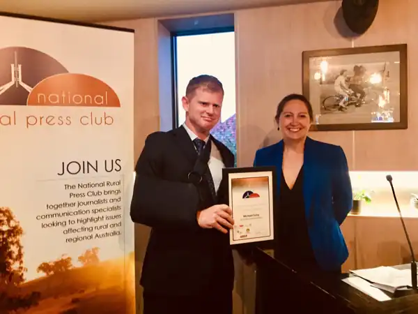 Mike Foley holding his Outstanding Contribution award certificate with Laureta Wallace at the 2019 NRPC Awards